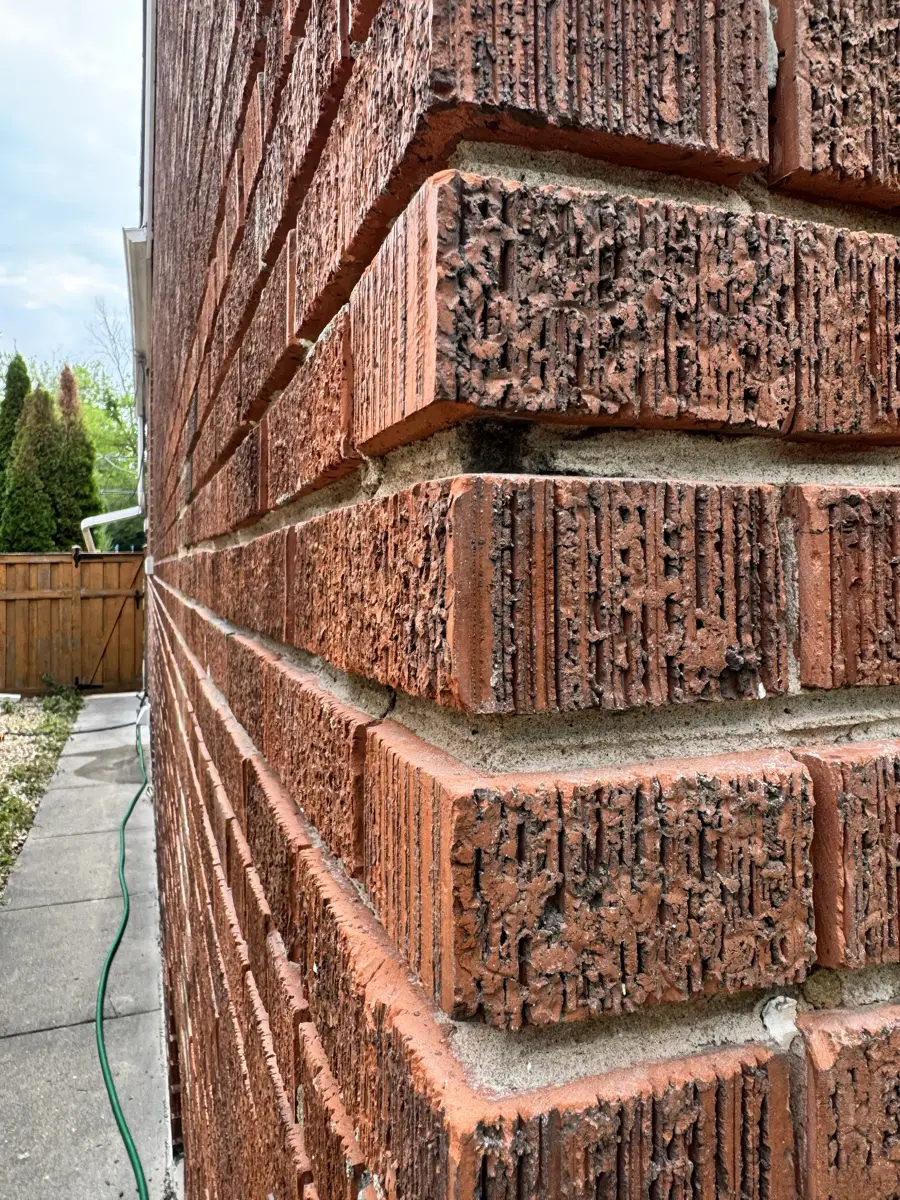 Chicago brick wall with old mortar joints ground out, ready for new mortar