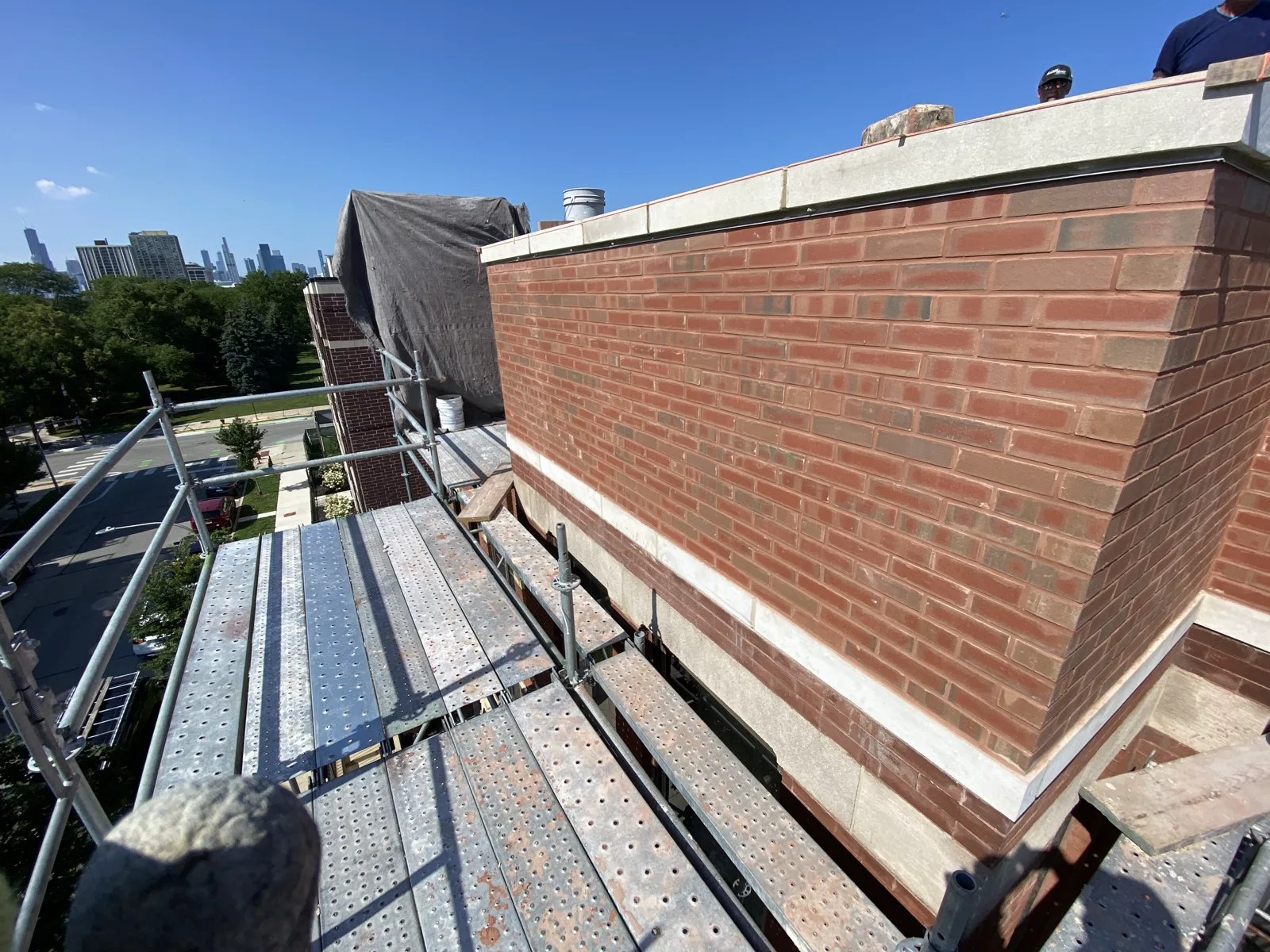 Rebuilt brick parapet with new stone coping