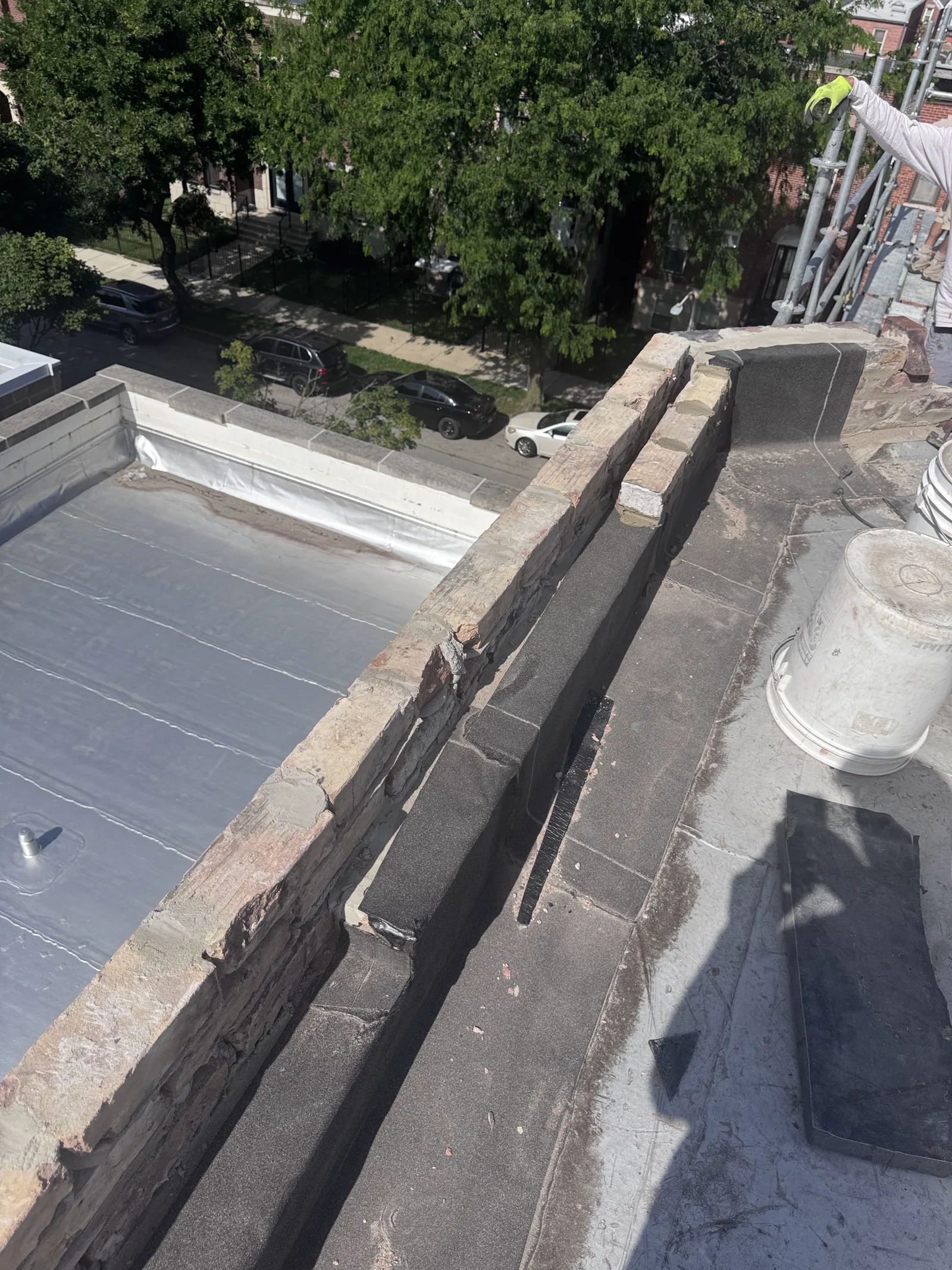 Parapet wall opened up with old coping removed during rebuild