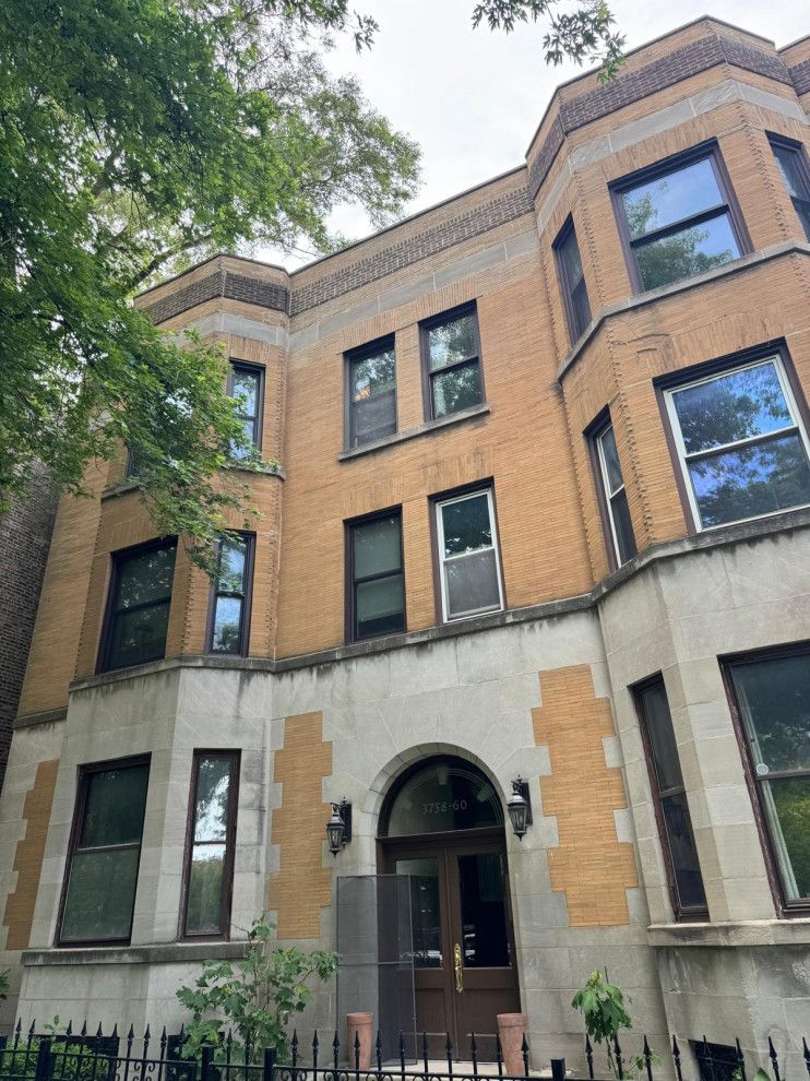 Window masonry after structural lintel replacement and brick restoration
