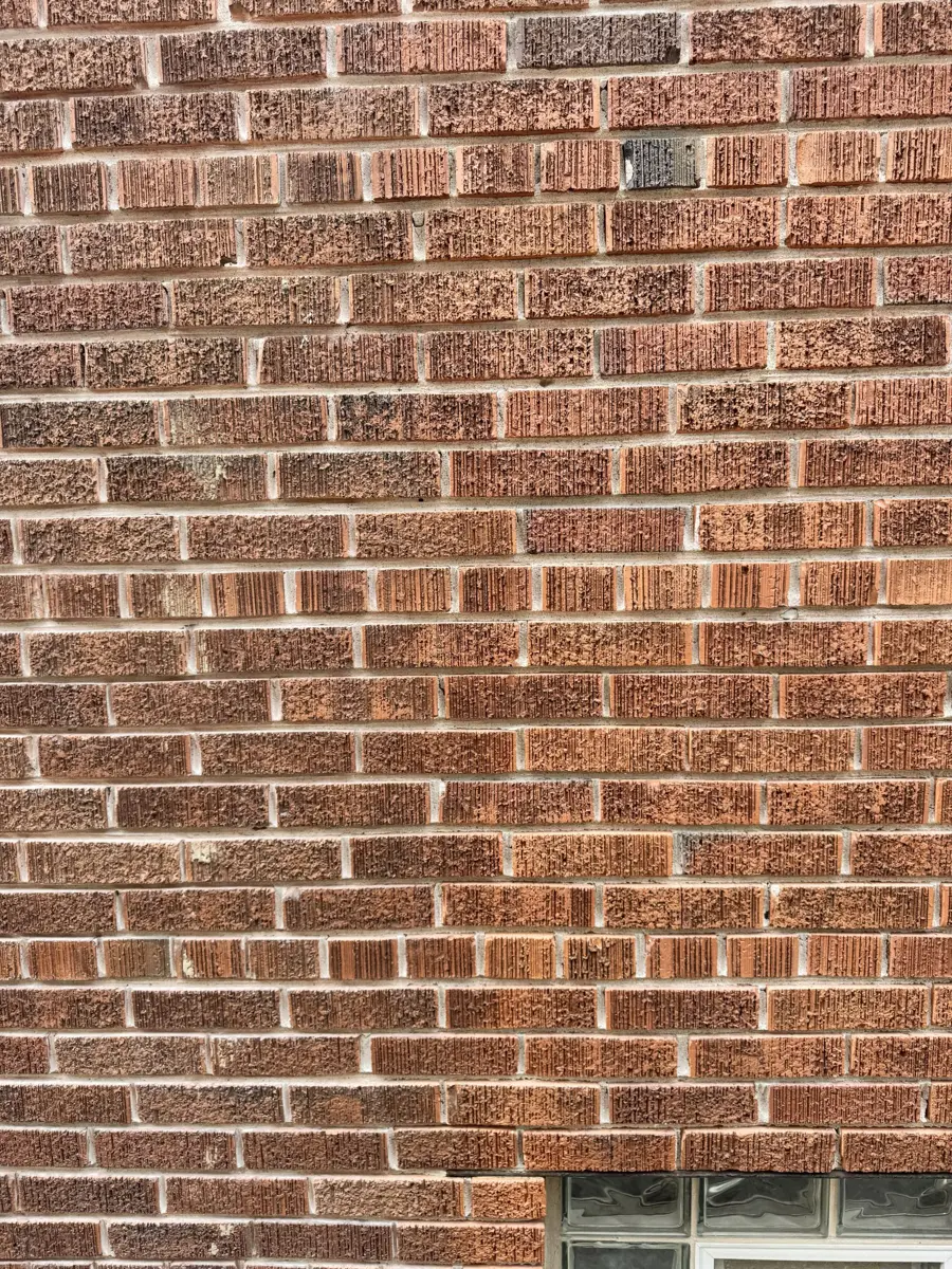 Deteriorated mortar joints ground out to a uniform depth before repointing