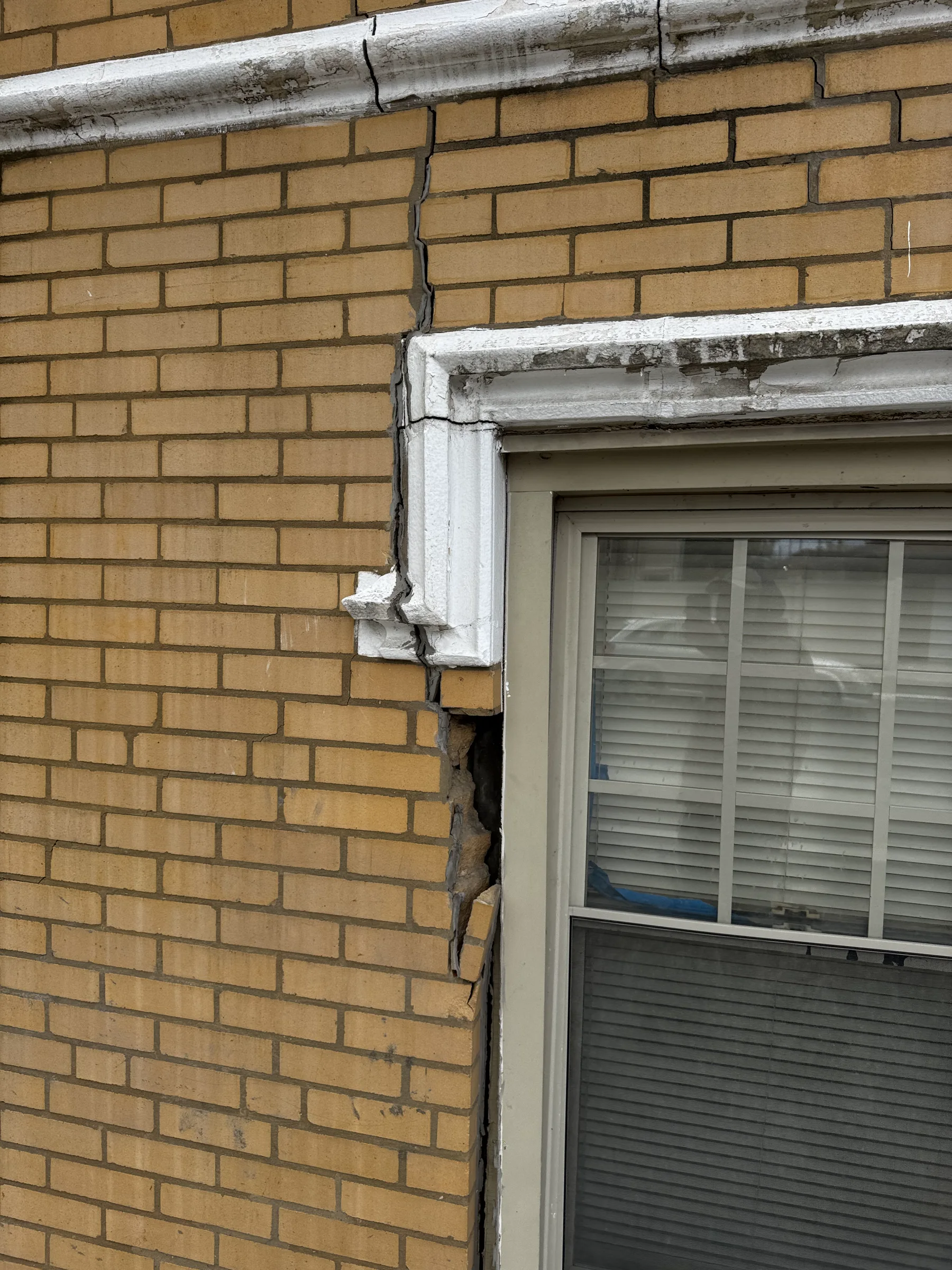 Severe cracking and separation beside a Chicago window caused by a failing lintel