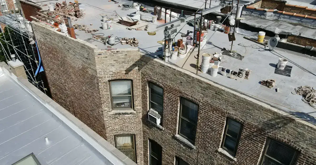 Multi-building parapet wall restoration aerial view