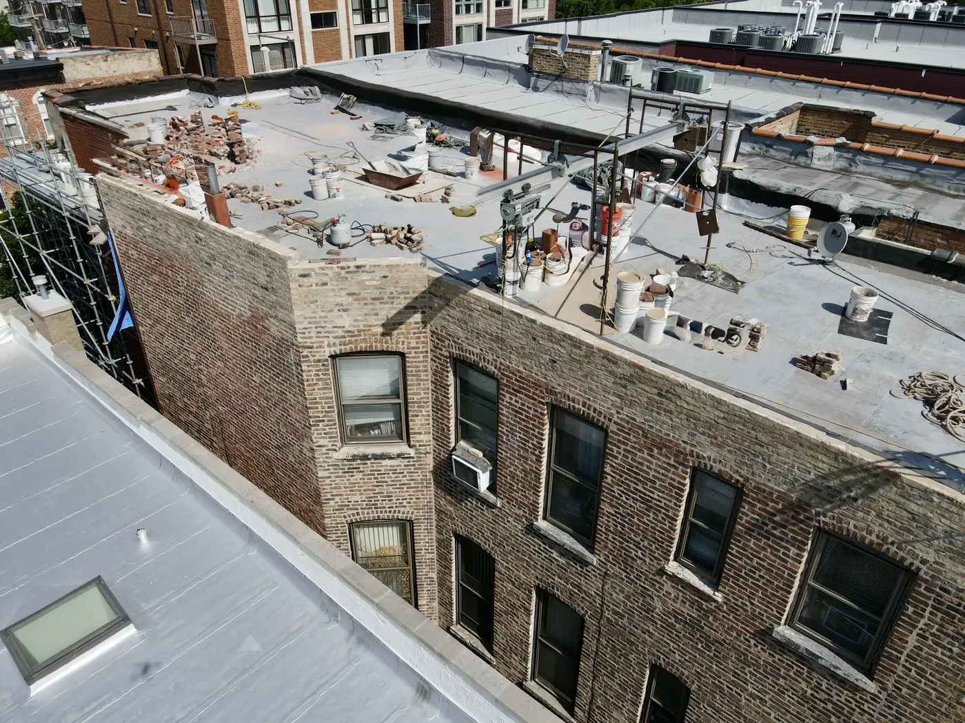 Multi-building parapet wall restoration aerial view