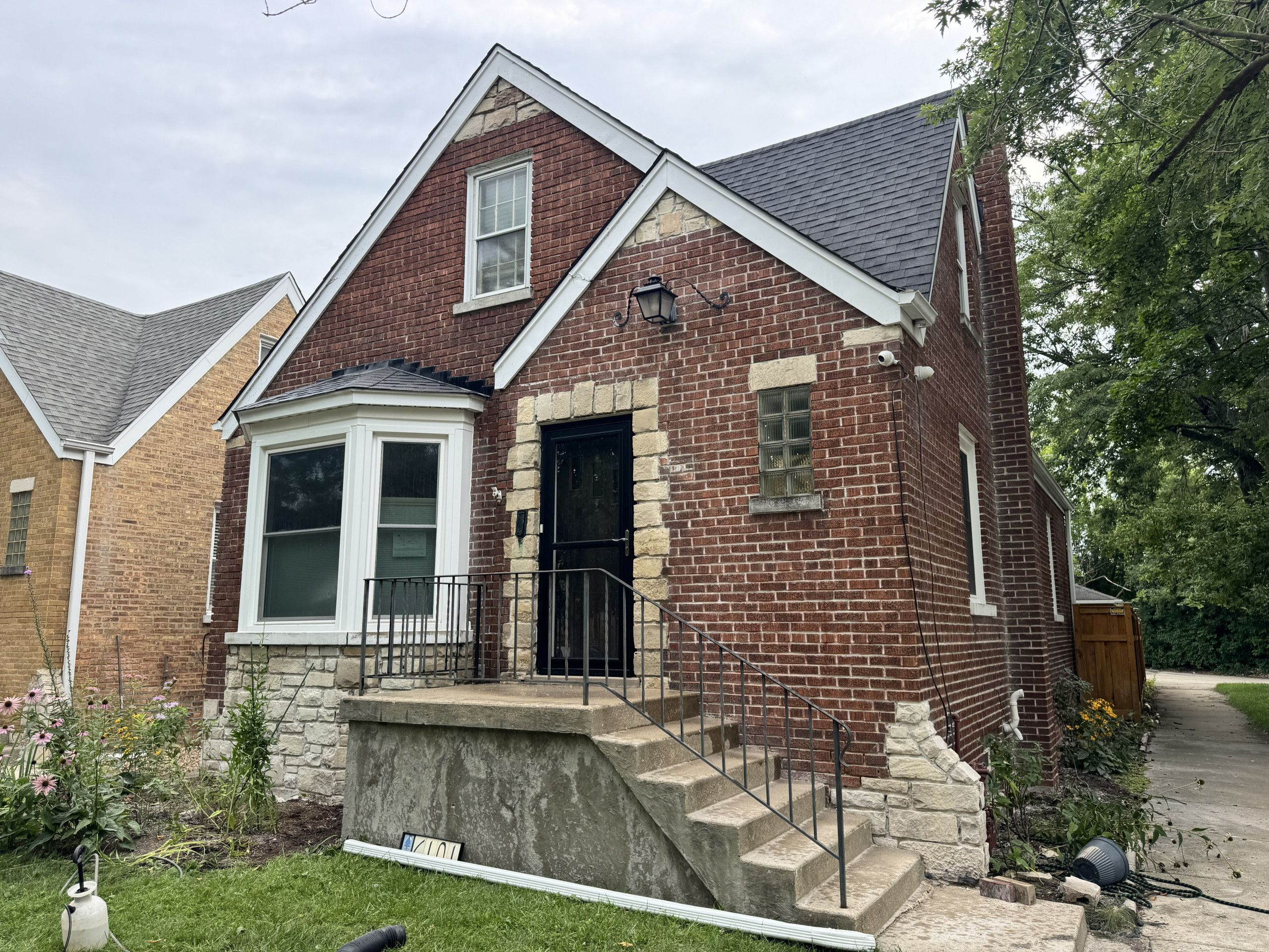 Front and side brick elevations before tuckpointing and mortar color matching
